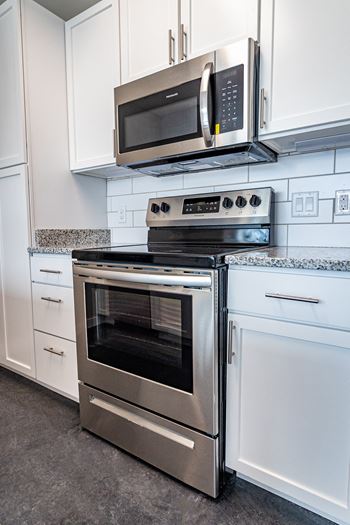 Modern finishes such as granite countertops and digital thermostats